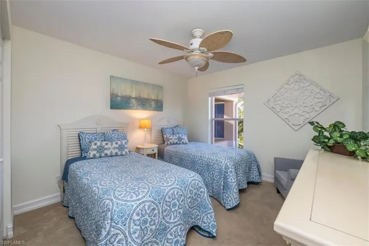 Bedroom with 2 twin beds that can be joined to make a king gives flexibility to visiting guests with tropical private views from the window.