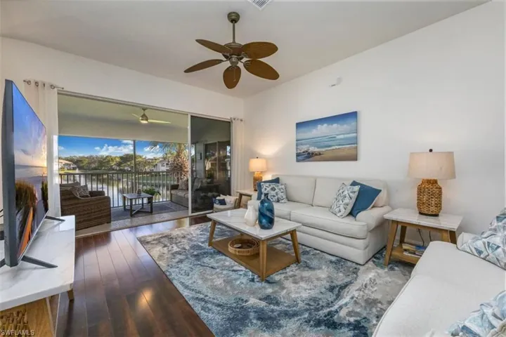 Coastal chic end unit 2nd floor condo invites you to take in the expansive water views and trade your show shovel for a sand shovel to Live Your Dream Naples!