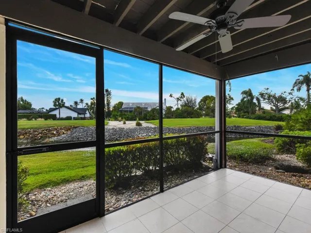 Unfurnished sunroom with a ceiling fan