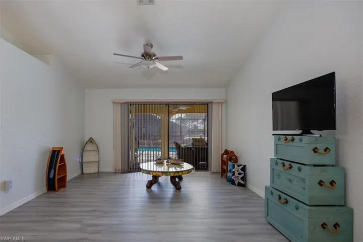 Luxury vinyl flooring and view of the pool