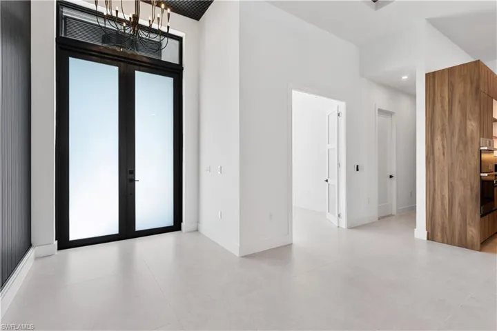 ENTRYWAY w/ STRIKING BLACK CEILING & BEAUTIFUL CHANDELIER is JUST the BEGINNING of the EXTRAORDINARY EXPERIENCE that AWAITS!