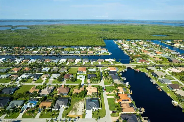 STUNNING 2,606 sq ft home in the HEART of SW CAPE CORAL neighborhood features 4 BEDROOMS, DEN/OFFICE/STUDY & 4.5 BATHROOMS
