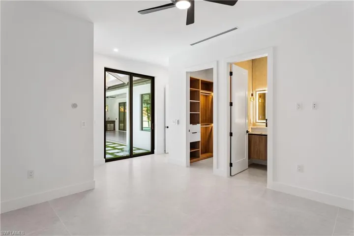 Master Bedroom 2 with private sliding doors to the outdoor oasis!