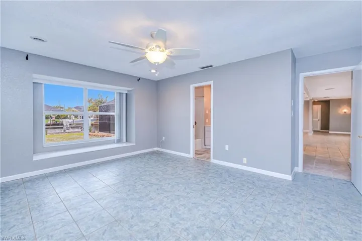 primary bedroom with ensuite and canal views