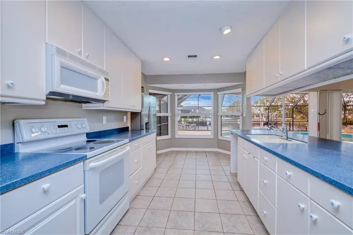 kitchen with breakfast nook and island