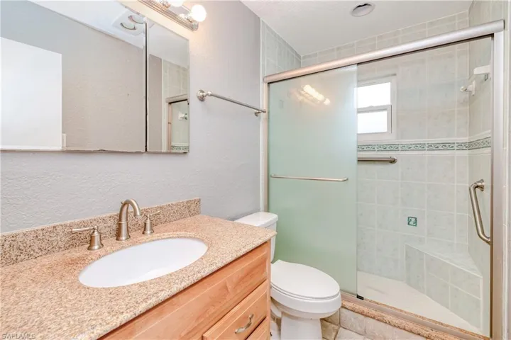 guest bathroom with tiled shower