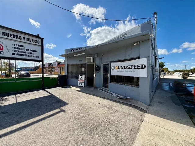 View of commercial property featuring a wall mounted AC