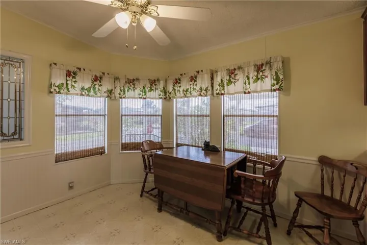 Dining space featuring crown molding and a healthy amount of sunlight