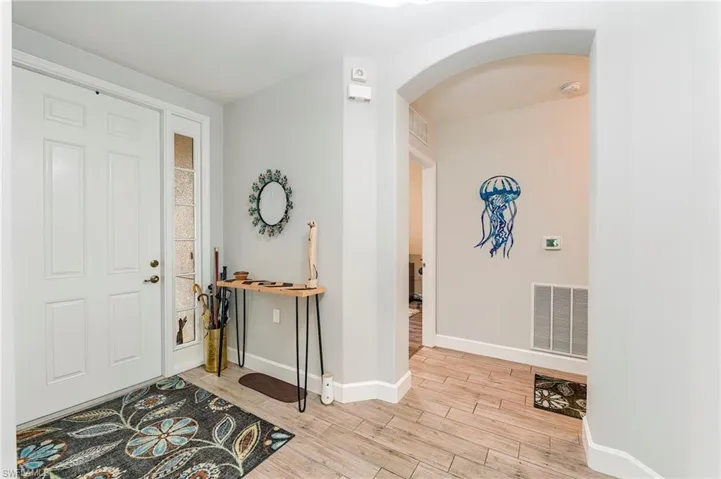 Hallway to the guest bedrooms, laundry, and garage