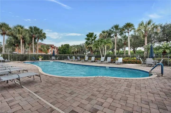 Community pool featuring a patio