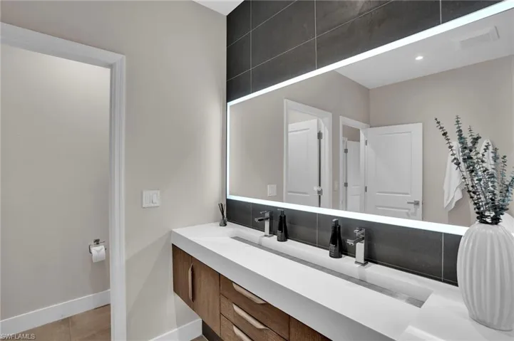 Bathroom with vanity and tile patterned floors