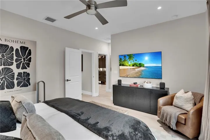 Bedroom with recessed lighting, a ceiling fan, and light wood-type flooring