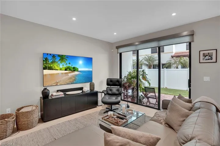 Living area with recessed lighting and wood finished floors