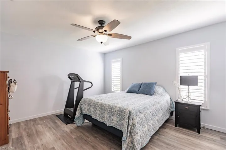 Bedroom featuring ceiling fan and light hardwood / wood-style floors