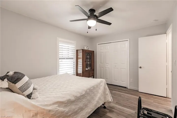 Bedroom featuring a closet, ceiling fan, and hardwood / wood-style flooring