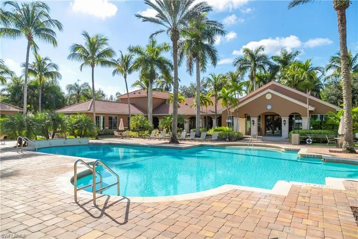 Community pool with a patio