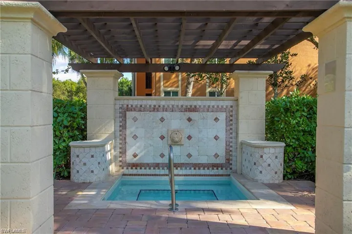 View of swimming pool featuring a pergola and a patio