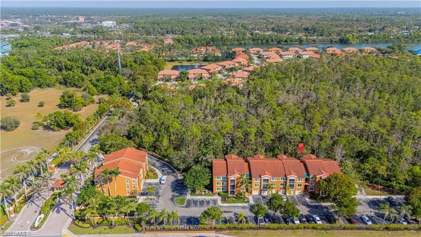 Aerial overview of property's location with nearby suburban area and a large body of water