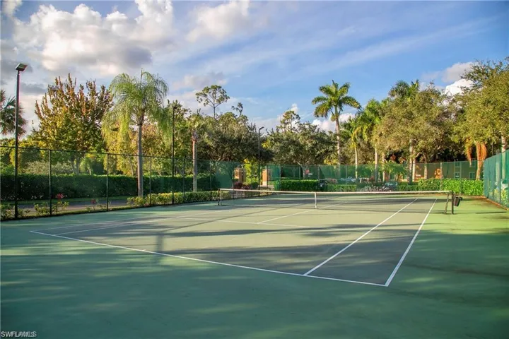 View of tennis court with community basketball court