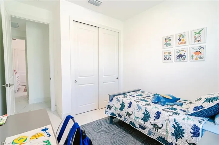 Recessed lighting illuminating the room with neutral wall finishes