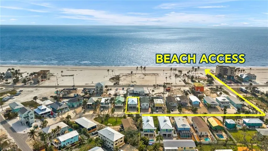 Birds eye view of property with a water view and a view of the beach - Virtually Edited Image