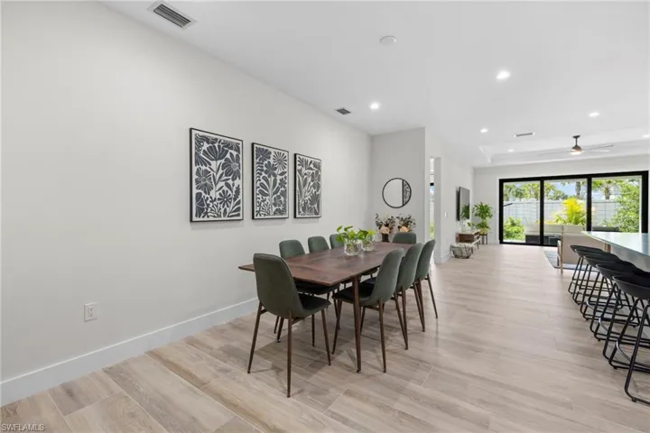 Open-concept interior featuring light wood-finish flooring throughout