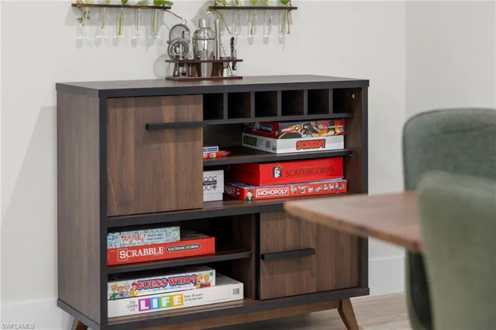 Wood-finish storage cabinet with integrated shelving and closed-door compartments