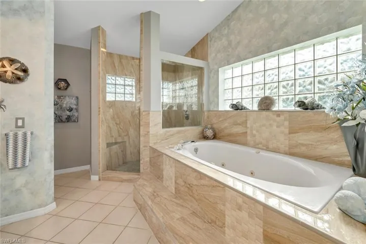 Primary bathroom with a spa tub