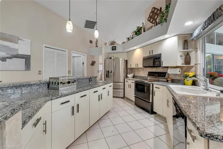 Spacious kitchen with a window to the lanai over the sink