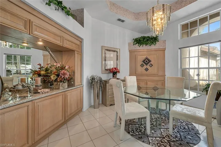 Formal dining room with built in bar area