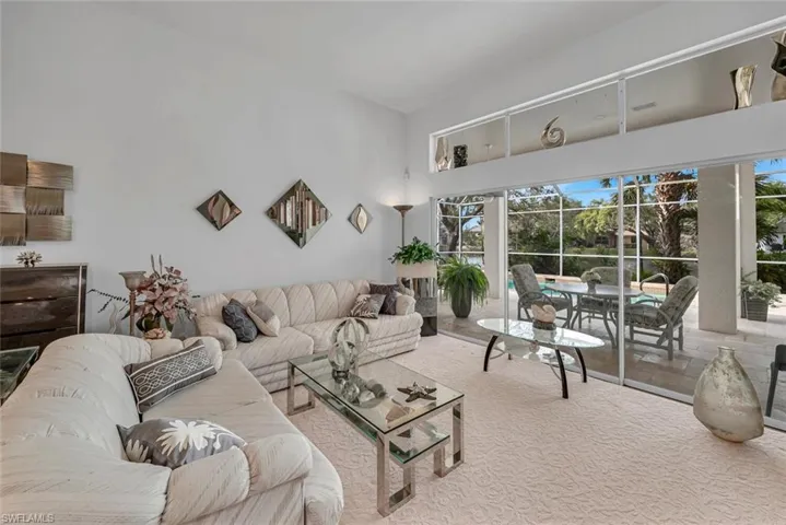 Gorgeous living room overlooking the pool and lanai