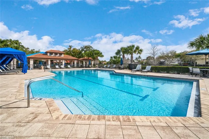 Club house heated lap pool and covered lounge area