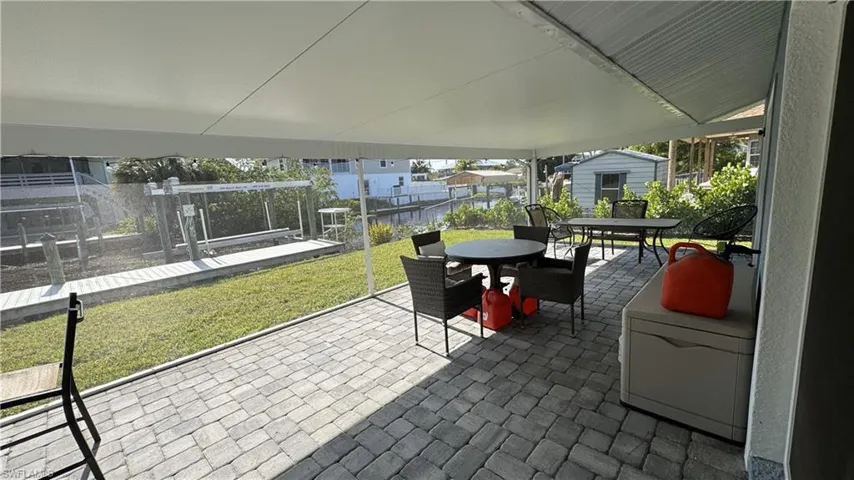 View of patio with outdoor dining area
