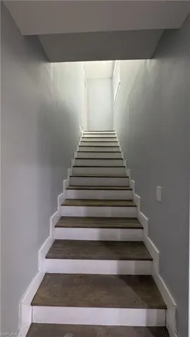 Stairs featuring baseboards