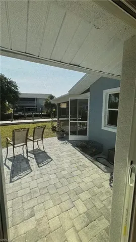 View of patio / terrace featuring a sunroom