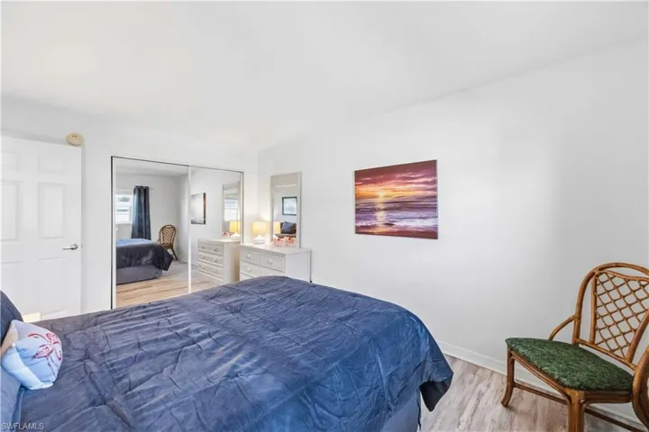 Bedroom featuring light wood finished floors and a closet