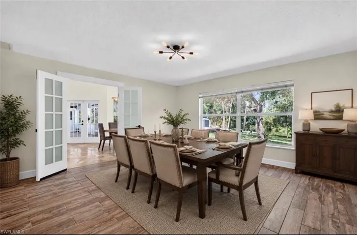 Staged photo of bonus room set as a large dining room.