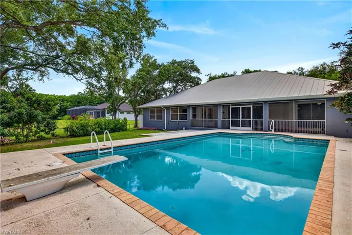 Deep pool with diving board, saltwater system & heater