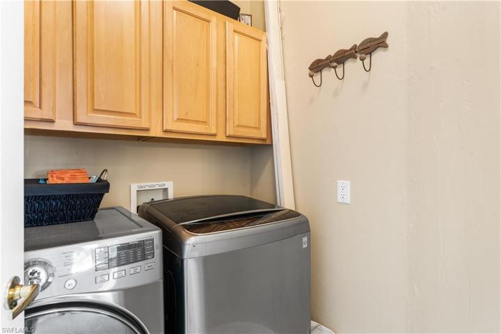 Laundry room with extra storage cabinets.