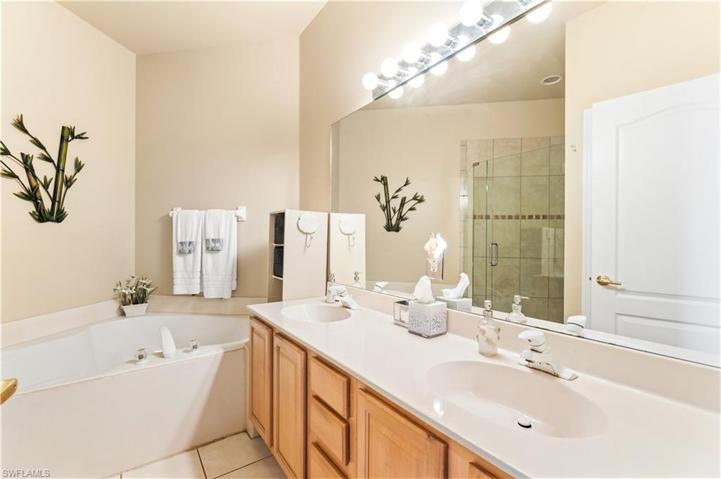 Master Bedroom offers dual vanities, soaking tub and a separate walk in shower.  Private water closet.