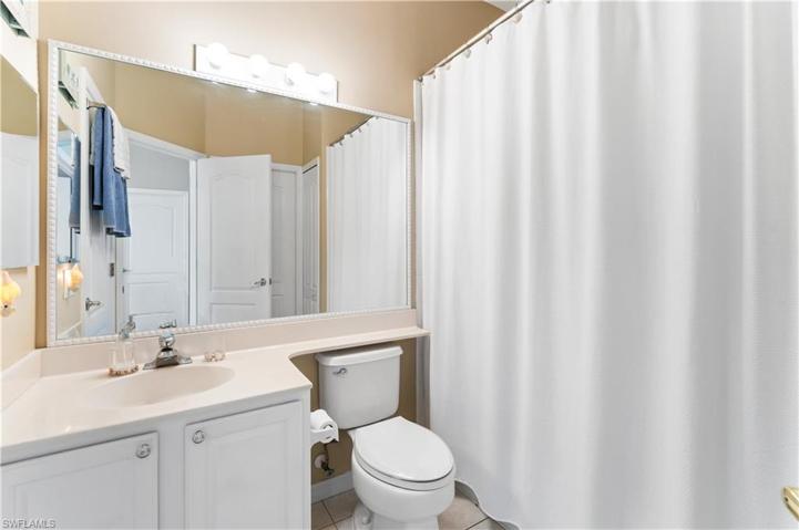 Laundry room with extra storage cabinets.
