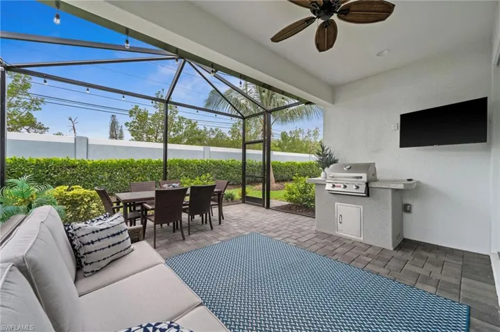 Sunroom / solarium featuring ceiling fan