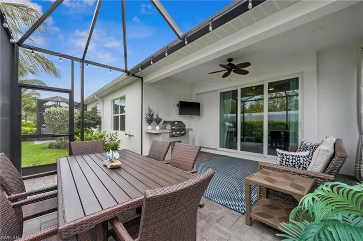 Sunroom / solarium featuring ceiling fan