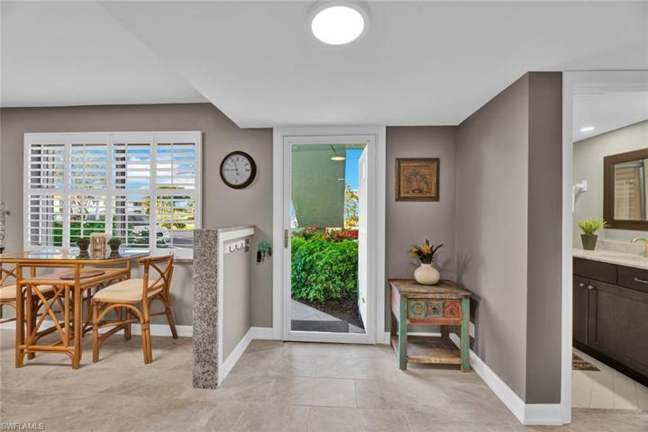 Front entrance with open kitchen to the right of entrance.