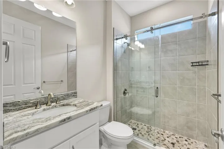 Guest bath has been upgraded with new shower and frameless glass enclosure.