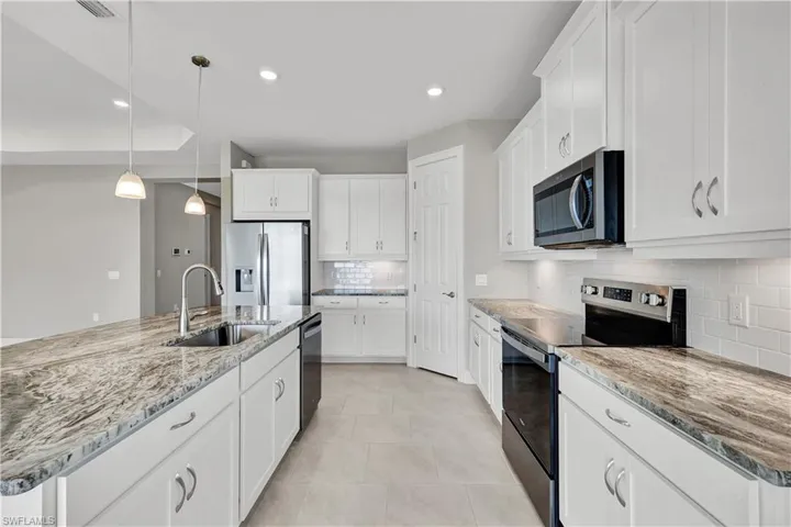 Beautiful granite counters in the kitchen.