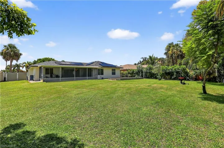 View of yard with a sunroom