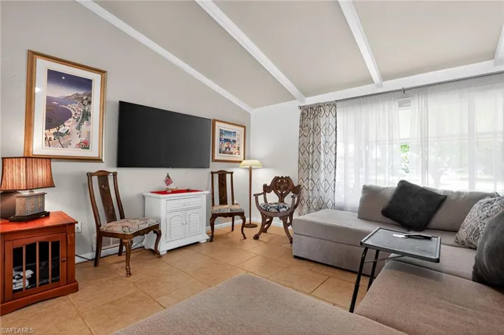 Living area with light tile patterned floors