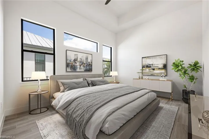 Bedroom with light wood finished floors and ceiling fan