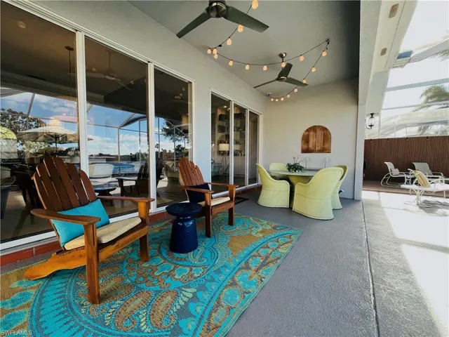 Covered Lanai featuring outdoor dining space and a ceiling fan
